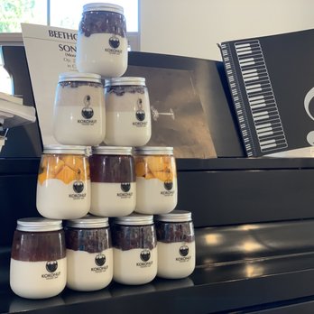 KOKONUT - Cloud Kitchen - a stack of jars of yogurt - Desserts Near Me - Anaheim, California KOKONUT - Cloud Kitchen - a stack of jars of yogurt - Desserts Near Me - Anaheim, California