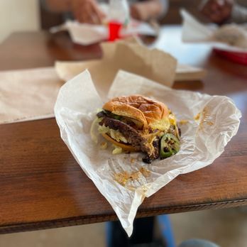 Woody's Hamburgers - a close up of a sandwich - Burgers Near Me - Hamilton, Texas Woody's Hamburgers - a close up of a sandwich - Burgers Near Me - Hamilton, Texas