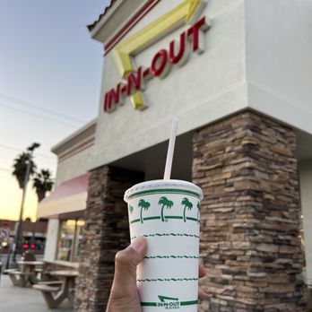 In-N-Out Burger - ows a hand holding a paper cup with a straw - Burgers Near Me - Van Nuys, California In-N-Out Burger - ows a hand holding a paper cup with a straw - Burgers Near Me - Van Nuys, California