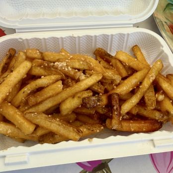 Backyard Pizza & Burgers - Side of garlic fries, $7, not bad but oddly coated in wet mixture that didn't taste like butter or oil? - Burgers Near Me - Puyallup, Washington