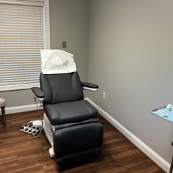 ClearSolutions Dermatology Group - Patient treatment room at ClearSolutions Dermatology Group's Lewes, DE office. The room is equipped with a comfortable chair