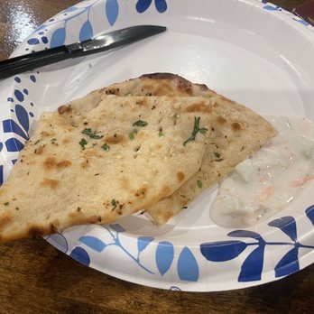Taj Indian Grill - Garlic naan and dipping sauce - Indian Near Me - Cooper City, Florida Taj Indian Grill - Garlic naan and dipping sauce - Indian Near Me - Cooper City, Florida