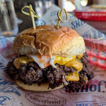 Big John's Tavern - Utterly fantastic. You can't see the thinly sliced jalapeños underneath (I like heat and crunch), but you can see they don't skimp on cheese - Dive Bars Near Me - Charleston, South Carolina
