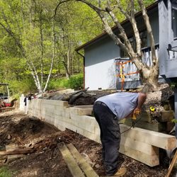 Seamless Gutters and More - Back yard retaining wall