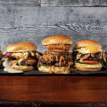 The Bullger Burger & Steak - a row of burgers - Steakhouses Near Me - Toronto, Ontario The Bullger Burger & Steak - a row of burgers - Steakhouses Near Me - Toronto, Ontario