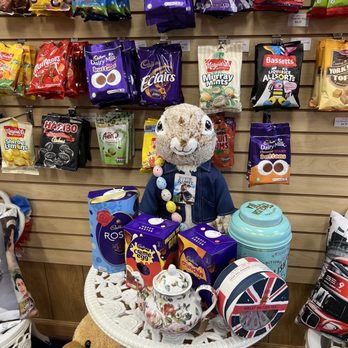 The British Depot - a teddy bear sitting at a table full of snacks - Grocery Near Me - Oakland Park, Florida