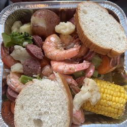 Shakin' Shellfish - Shrimp boil - includes crab, sausage, corn on the cob, potatoes, lemon and bread. We added the California blend veggies to ours.
