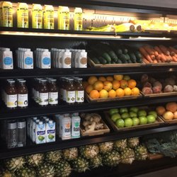 Quenche Juicery - All of the fresh produce on display next to some great alternative beverage options