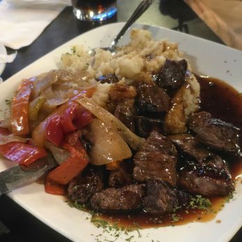 744 West Bar & Grill - Steak Tips Teriayaki with Mashed Potatoes, Grilled Peppers and Onions with Beef Gravy. "Smaller portion" more than enough for one person. - American Near Me - West Haven, Connecticut 744 West Bar & Grill - Steak Tips Teriayaki with Mashed Potatoes, Grilled Peppers and Onions with Beef Gravy. "Smaller portion" more than enough for one person. - American Near Me - West Haven, Connecticut