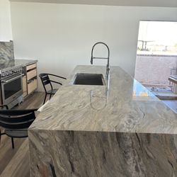 Arizona Granite Solutions - A pic of island just after sealed.  Chairs around to remind us not to use until dried.