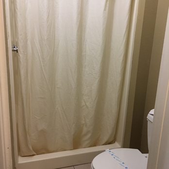 Holland Inn and Suites -Taft - Small but clean bathroom with newer shower. - Hotels Near Me - Taft, California