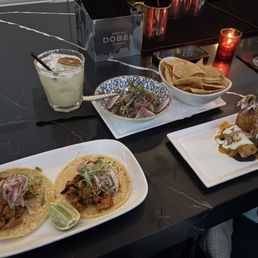 Happy hour adobo chicken, flautas, and tuna ceviche.