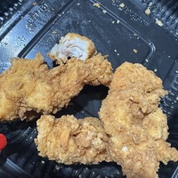 Dark tenders that were cold and soggy but still pink inside.