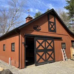 AmeriGutter - 5Inch Black Gutter on a Barn