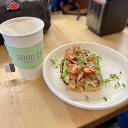Good Day Cafe - Large Earl Grey tea with oat milk and avocado toast (sourdough), with greens, tomatoes, and bacon