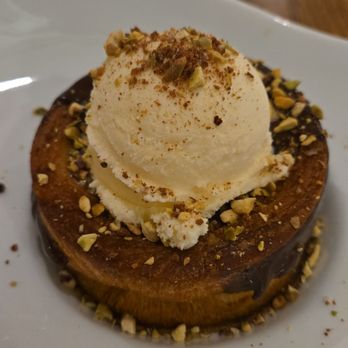 BC Bistro - Chocolate dipped Croissant stuffed with pistachio mousse topped with ice cream and chopped pistachios - Bars Near Me - Floral Park, New York BC Bistro - Chocolate dipped Croissant stuffed with pistachio mousse topped with ice cream and chopped pistachios - Bars Near Me - Floral Park, New York