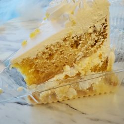 Tres leches cake slice filled with pineapple and coconut