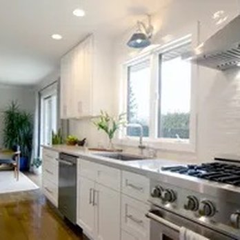 Palmira Design & Construction - a kitchen with stainless steel appliances - General Contractors Near Me Palmira Design & Construction - a kitchen with stainless steel appliances - General Contractors Near Me