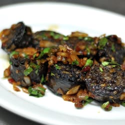 Gyuma - Tibetan style beef sausage. Served stir-fried with chopped onions