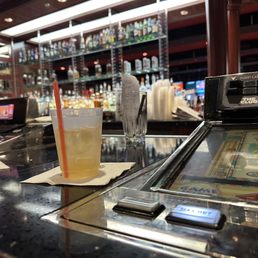 a pinball machine and a glass of beer a pinball machine and a glass of beer
