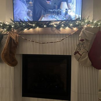 Stratagem Construction - a fireplace with stockings hanging on it - General Contractors Near Me - Chicago, Illinois