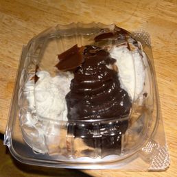 a chocolate cupcake in a plastic container