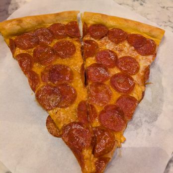 Chickie’s Pizzeria - One slice cut in half - Pizza Near Me - Elk Grove, California Chickie’s Pizzeria - One slice cut in half - Pizza Near Me - Elk Grove, California