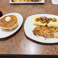 Perkins Restaurant & Bakery - everything omelette with hashbrowns and pancakes