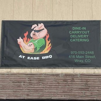 At Ease BBQ - a sign on the side of a building - Barbeque Near Me - Wray, Colorado At Ease BBQ - a sign on the side of a building - Barbeque Near Me - Wray, Colorado