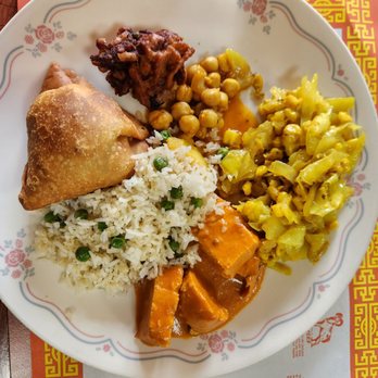 Mirch Masala - a plate of food on a table - Indian Near Me - Madison, Wisconsin