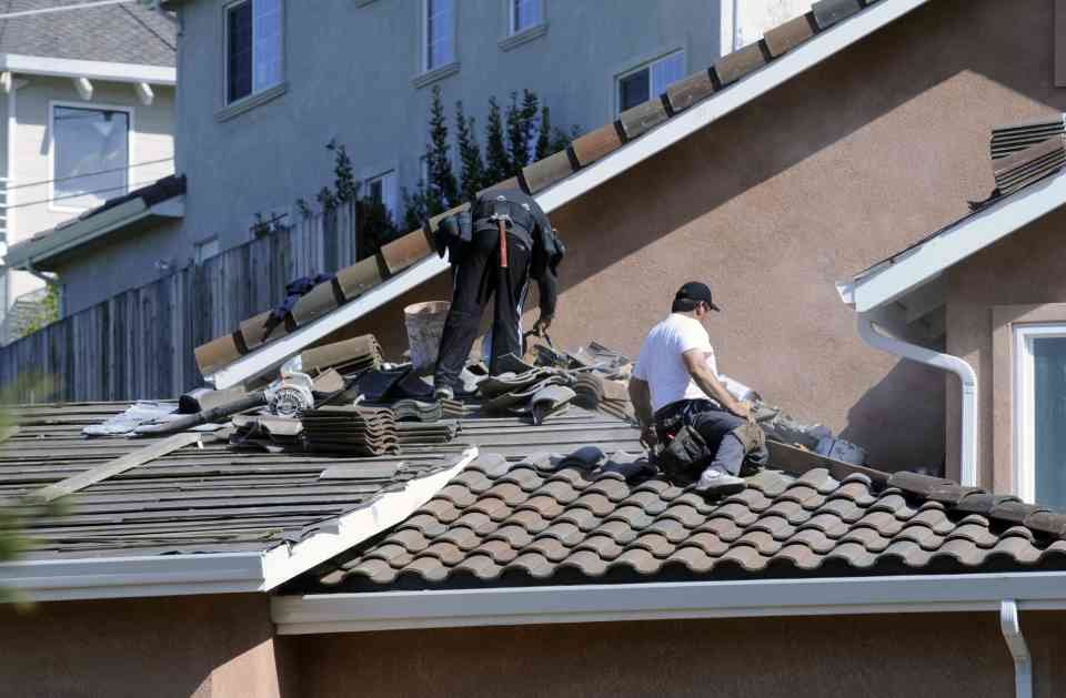 Slide of Two Men Roofing