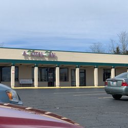 A Total Tan - Outside of salon in parking lot.