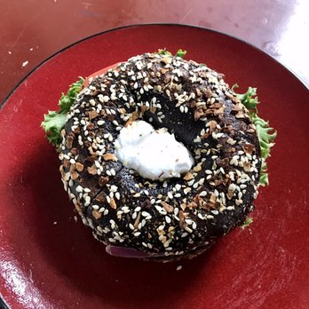 Moe's Broadway Bagel - Pumpernickel with vegan cream cheese, lettuce, tomato, and onion - Bagels Near Me - Denver, Colorado
