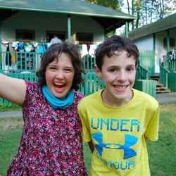 Summit Camp & Travel - Joy on the face of a girl who were told rarely smiles at school.