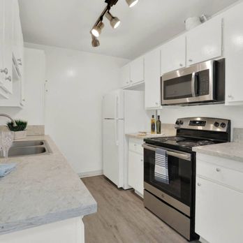 Copa Ladeene Apartments - a kitchen with white cabinets and stainless steel appliances - Apartments Near Me - Torrance, California Copa Ladeene Apartments - a kitchen with white cabinets and stainless steel appliances - Apartments Near Me - Torrance, California