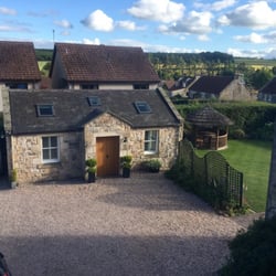 Mansedale House & Cottage - View of parking area, two-unit cottage, and shared yard/garden space.