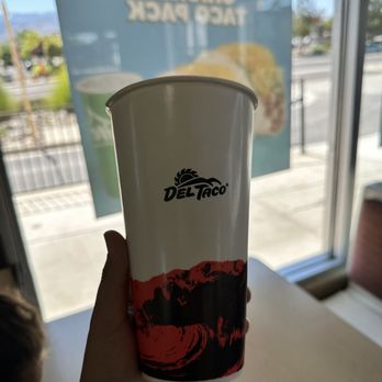 Del Taco - a hand holding a cup of coffee - Fast Food Near Me - Reno, Nevada Del Taco - a hand holding a cup of coffee - Fast Food Near Me - Reno, Nevada