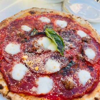 7 Enoteca - a pizza on a white plate - Italian Near Me - Oakville, Ontario
