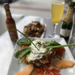Anastasia Cafe - Eggs Laguna, side of potatoes and a mimosa