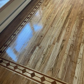 Ideal Wood Flooring - a hardwood floor with a decorative border - Flooring Near Me Ideal Wood Flooring - a hardwood floor with a decorative border - Flooring Near Me