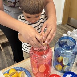 Little Discoverers Learning Center - Children making homemade Lemonade