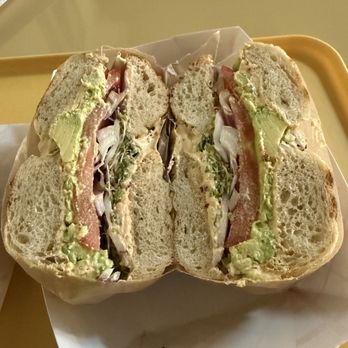 Duckie's Woodfire - Mortgage payment- smashed avocado, lettuce, tomato, red onion, chili crisp cream cheese - Bagels Near Me - Oklahoma City, Oklahoma