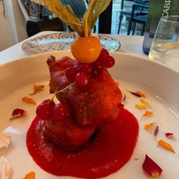Cod fish fritter with a red pepper cream sauce Cod fish fritter with a red pepper cream sauce