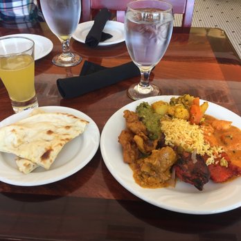 Saffron Indian Cuisine - My first delicious plate, mimosa, and Naan Bread - Indian Near Me - Greensboro, North Carolina