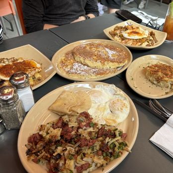 Snooze, an A.M. Eatery - Pork fried rice, shrimp and grits, corn beef, and pineapple upside down pancakes - Breakfast & Brunch Near Me - Tustin, California
