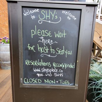 Shy’s Place - a sign on a porch - American Near Me - Dundas, Ontario