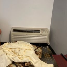Unplugged old air conditioning & nasty sheets and comforter. Unplugged old air conditioning & nasty sheets and comforter.