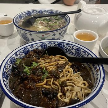 Highland Noodles - Beef hand pulled noodle soup, normal thickness (back) and pork and eggplant noodles that came with broth on the side, thin (front) - Noodles Near Me - Milpitas, California Highland Noodles - Beef hand pulled noodle soup, normal thickness (back) and pork and eggplant noodles that came with broth on the side, thin (front) - Noodles Near Me - Milpitas, California