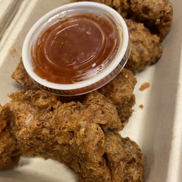 a plate of fried chicken with a side of ketchup a plate of fried chicken with a side of ketchup