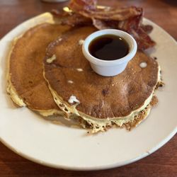 Maxi's Restaurant - Banana Pancakes with a side of bacon